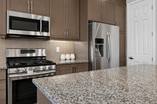 150 Osborne Rise Sw, Airdrie, AB - Indoor Photo Showing Kitchen With Stainless Steel Kitchen With Upgraded Kitchen