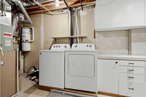 18-15 Silver Springs Way Nw, Airdrie, AB - Indoor Photo Showing Laundry Room