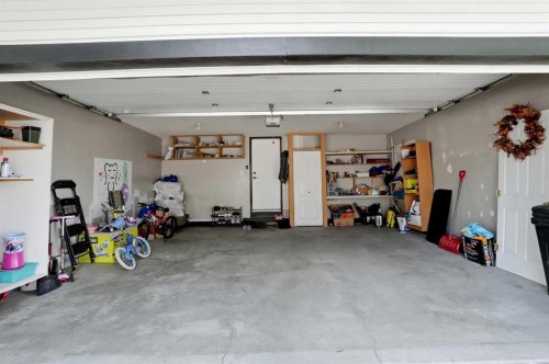 18-15 Silver Springs Way Nw, Airdrie, AB - Indoor Photo Showing Garage