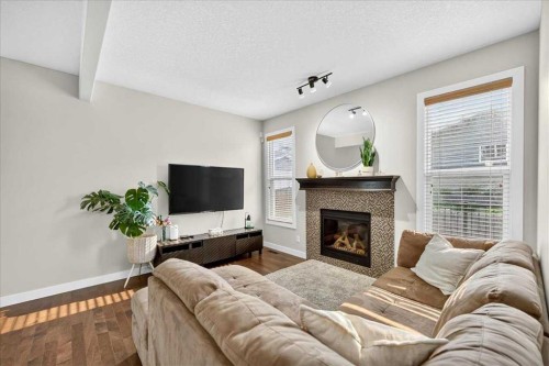 28 Evansborough Gate Nw, Calgary, AB - Indoor Photo Showing Living Room With Fireplace
