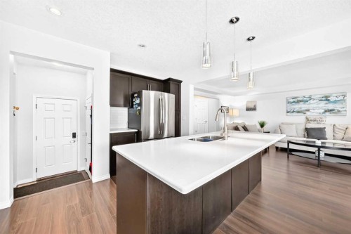 141 Shoreline Vista, Chestermere, AB - Indoor Photo Showing Kitchen With Double Sink With Upgraded Kitchen