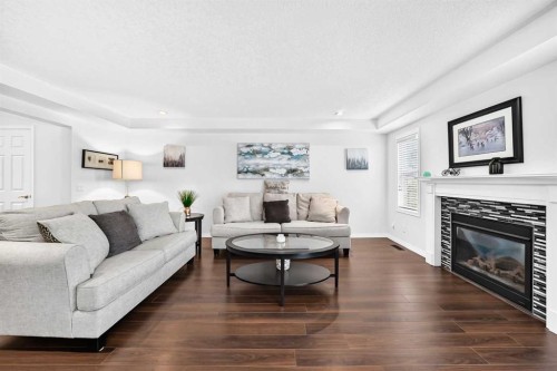 141 Shoreline Vista, Chestermere, AB - Indoor Photo Showing Living Room With Fireplace