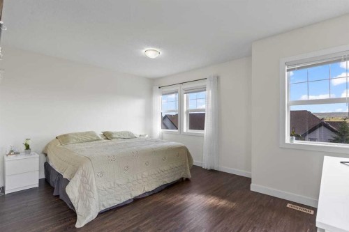 56-28 Heritage Drive, Cochrane, AB - Indoor Photo Showing Bedroom