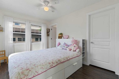 56-28 Heritage Drive, Cochrane, AB - Indoor Photo Showing Bedroom