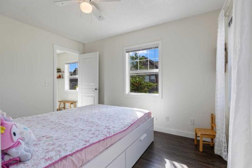 56-28 Heritage Drive, Cochrane, AB - Indoor Photo Showing Bedroom
