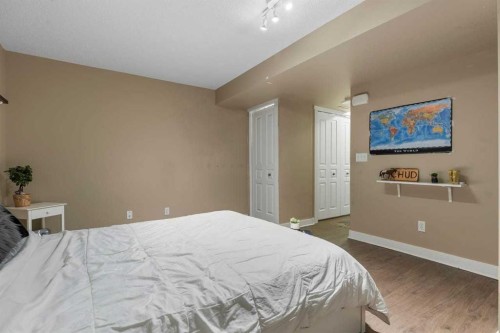 56-28 Heritage Drive, Cochrane, AB - Indoor Photo Showing Bedroom
