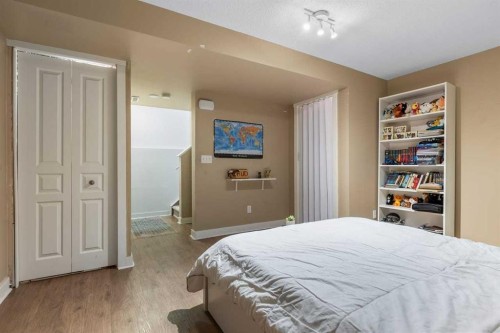 56-28 Heritage Drive, Cochrane, AB - Indoor Photo Showing Bedroom