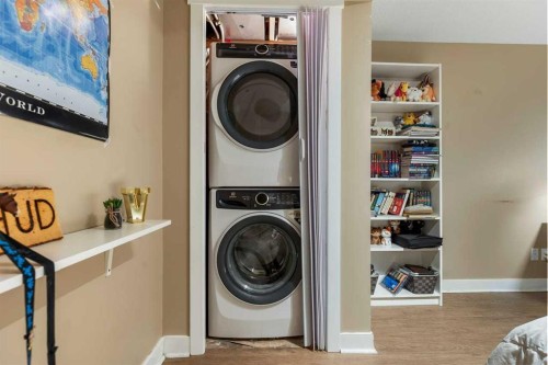 56-28 Heritage Drive, Cochrane, AB - Indoor Photo Showing Laundry Room