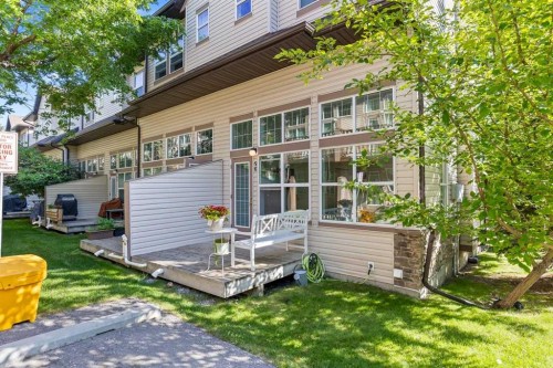 56-28 Heritage Drive, Cochrane, AB - Outdoor With Deck Patio Veranda