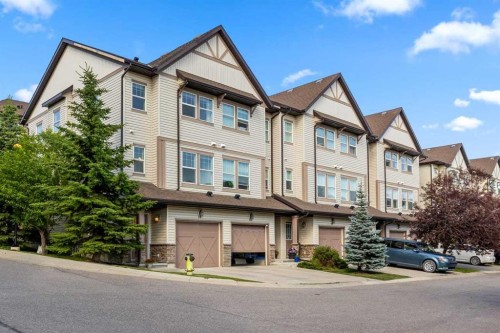 56-28 Heritage Drive, Cochrane, AB - Outdoor With Facade