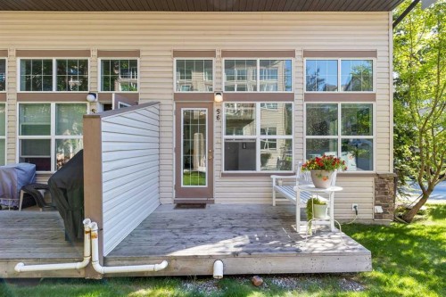 56-28 Heritage Drive, Cochrane, AB - Outdoor With Deck Patio Veranda With Exterior