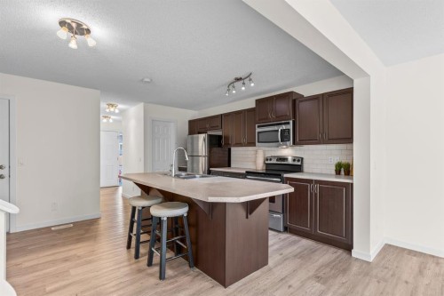 790 River Heights Crescent, Cochrane, AB - Indoor Photo Showing Kitchen With Stainless Steel Kitchen