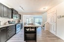 790 River Heights Crescent, Cochrane, AB  - Indoor Photo Showing Kitchen With Stainless Steel Kitchen With Double Sink With Upgraded Kitchen 