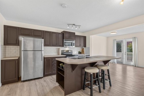 790 River Heights Crescent, Cochrane, AB - Indoor Photo Showing Kitchen With Stainless Steel Kitchen
