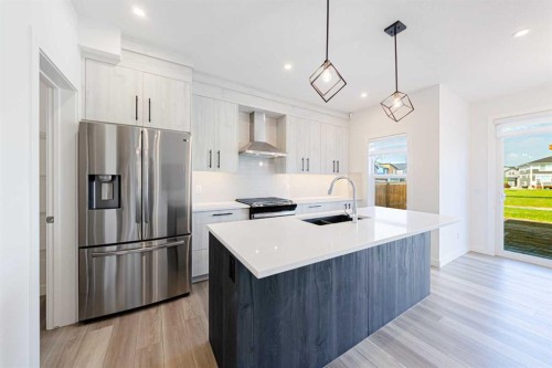 293 Carringsby Way Nw, Calgary, AB - Indoor Photo Showing Kitchen With Stainless Steel Kitchen With Double Sink With Upgraded Kitchen