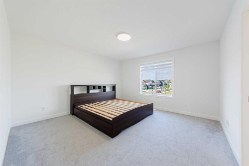 293 Carringsby Way Nw, Calgary, AB - Indoor Photo Showing Bedroom