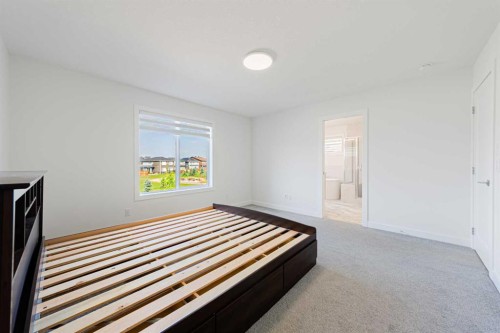 293 Carringsby Way Nw, Calgary, AB - Indoor Photo Showing Bedroom