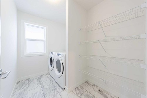 293 Carringsby Way Nw, Calgary, AB - Indoor Photo Showing Laundry Room