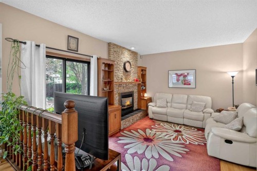 80 Hawkhill Way Nw, Calgary, AB - Indoor Photo Showing Living Room With Fireplace