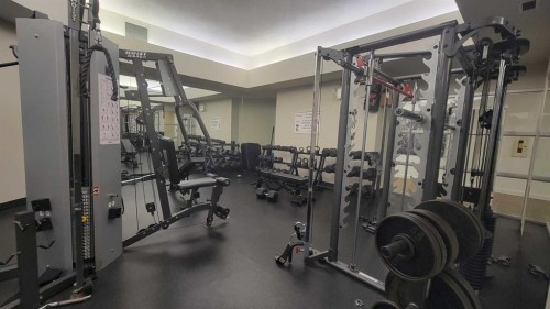 13-2000 Edenwold Heights Nw, Calgary, AB - Indoor Photo Showing Gym Room
