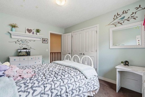 68 Drake Landing Way, Okotoks, AB - Indoor Photo Showing Bedroom