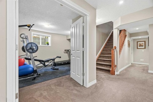 68 Drake Landing Way, Okotoks, AB - Indoor Photo Showing Gym Room