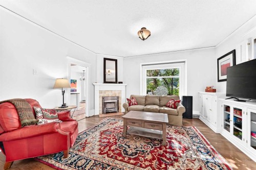 1925 10 Street Sw, Calgary, AB - Indoor Photo Showing Living Room With Fireplace