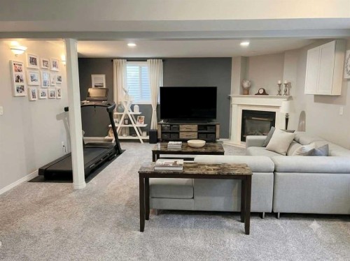 335 Covington Bay Ne, Calgary, AB - Indoor Photo Showing Living Room With Fireplace