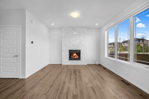 641 Southwinds Close Sw, Airdrie, AB - Indoor Photo Showing Other Room With Fireplace