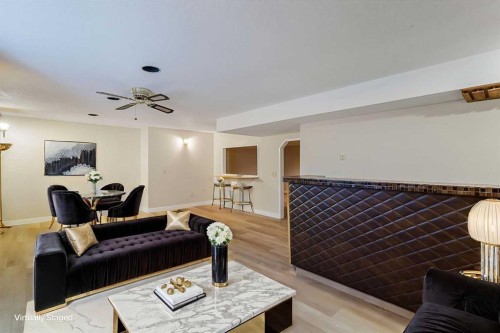 1111 Berkley Drive Nw, Calgary, AB - Indoor Photo Showing Living Room With Fireplace