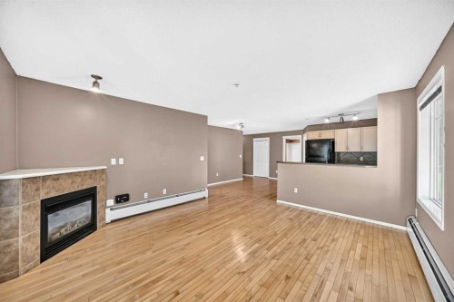 3109-70 Panamount Drive Nw, Calgary, AB - Indoor With Fireplace