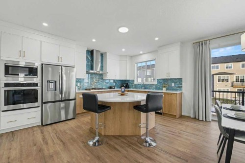 3034 Southwinds Place Sw, Airdrie, AB - Indoor Photo Showing Kitchen With Upgraded Kitchen