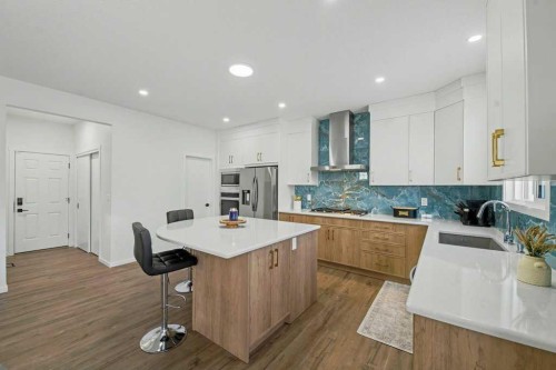 3034 Southwinds Place Sw, Airdrie, AB - Indoor Photo Showing Kitchen With Upgraded Kitchen