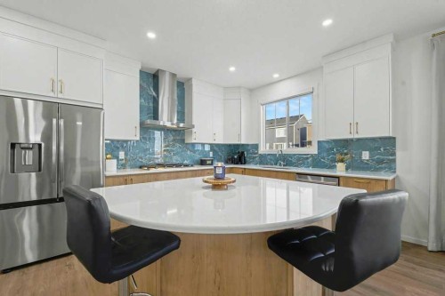 3034 Southwinds Place Sw, Airdrie, AB - Indoor Photo Showing Kitchen With Upgraded Kitchen