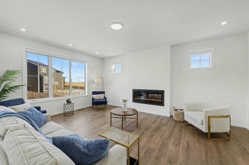 3034 Southwinds Place Sw, Airdrie, AB - Indoor Photo Showing Living Room With Fireplace