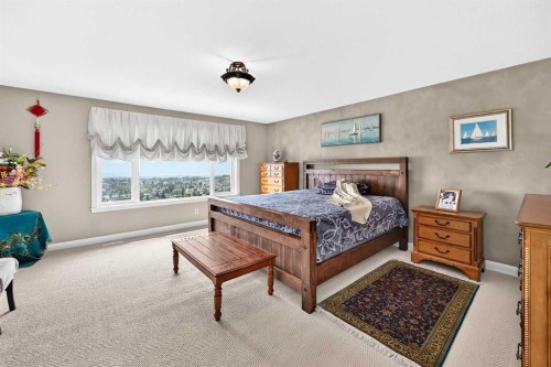 311 Rocky Ridge Drive Nw, Calgary, AB - Indoor Photo Showing Bedroom