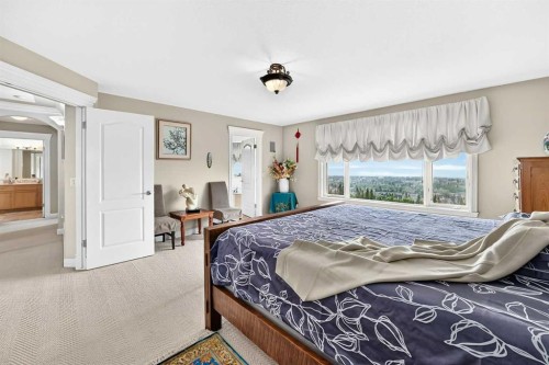 311 Rocky Ridge Drive Nw, Calgary, AB - Indoor Photo Showing Bedroom