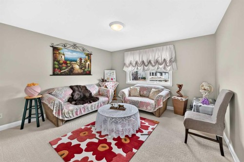 311 Rocky Ridge Drive Nw, Calgary, AB - Indoor Photo Showing Living Room