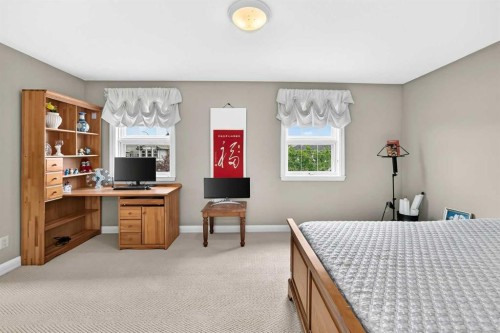 311 Rocky Ridge Drive Nw, Calgary, AB - Indoor Photo Showing Bedroom