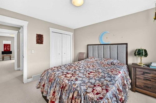 311 Rocky Ridge Drive Nw, Calgary, AB - Indoor Photo Showing Bedroom