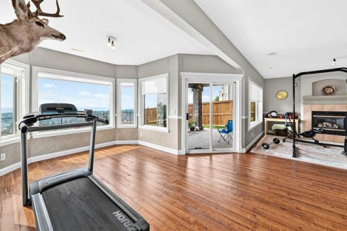 311 Rocky Ridge Drive Nw, Calgary, AB - Indoor Photo Showing Gym Room