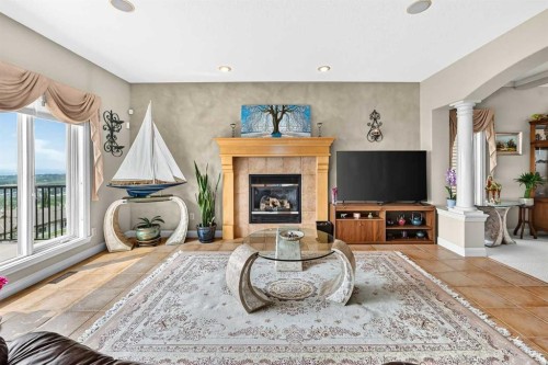 311 Rocky Ridge Drive Nw, Calgary, AB - Indoor Photo Showing Living Room With Fireplace