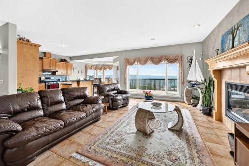 311 Rocky Ridge Drive Nw, Calgary, AB - Indoor Photo Showing Living Room With Fireplace