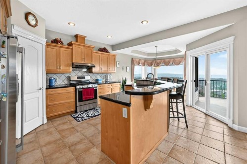 311 Rocky Ridge Drive Nw, Calgary, AB - Indoor Photo Showing Kitchen With Stainless Steel Kitchen