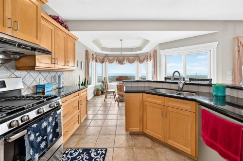 311 Rocky Ridge Drive Nw, Calgary, AB - Indoor Photo Showing Kitchen With Double Sink