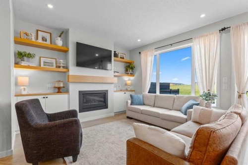 45 Savoy Landing Se, Calgary, AB - Indoor Photo Showing Living Room With Fireplace