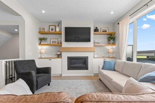 45 Savoy Landing Se, Calgary, AB - Indoor Photo Showing Living Room With Fireplace