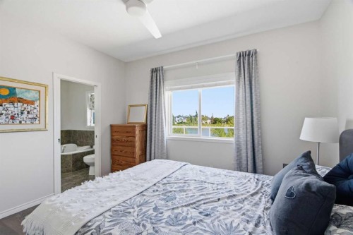 124 West Creek Glen, Chestermere, AB - Indoor Photo Showing Bedroom