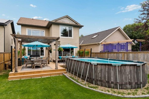 391 Auburn Bay Heights Se, Calgary, AB - Outdoor With Above Ground Pool With Deck Patio Veranda