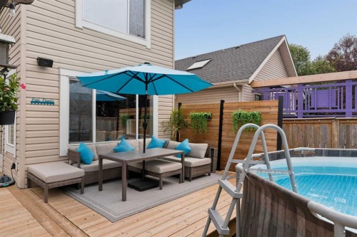 391 Auburn Bay Heights Se, Calgary, AB - Outdoor With Above Ground Pool With Deck Patio Veranda With Exterior